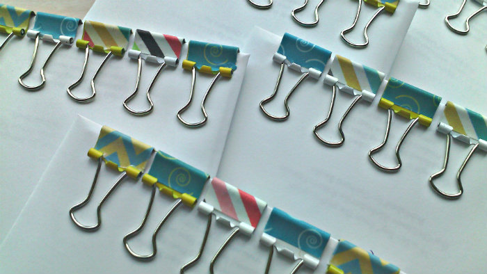 assortment of tiny binder clips decorated with washi tape