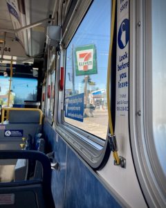 7 Eleven sign as photographed from inside a city bus